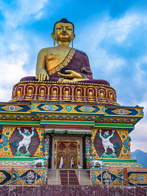 huge buddha golden statue from different perspective with moody sky at evening huge buddha golden statue from different perspective with moody sky at evening image is taken at giant buddha statue tawang arunachal pradesh india.