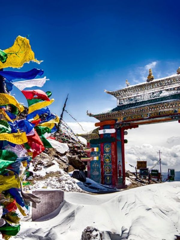 Screenshot 2023-04-08 at 2.40.13 AM Tawang, Arunachal Pradesh, India. The Buddhist architecture, prayer flags and full of snow on a misty morning at Tawang, Arunachal Pradesh, North East India.